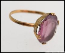 A vintage large ladies 9ct gold and amethyst set dress ring.