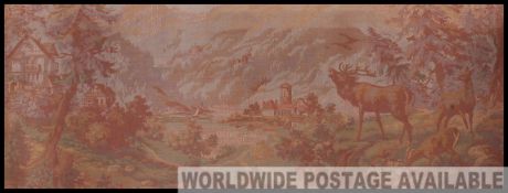 A large 20th century framed tapestry panel set within a gilt frame.