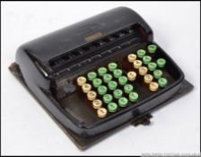 A vintage 20th century German made portable Contex counting machine in metal case