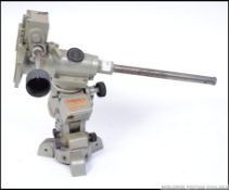 A Chinese made 20th century table top mounted microscope with cap to lens long arm etc.