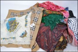 A ladies 20th century Liberty of London paisley shawl together with a Burberry checkered ladies