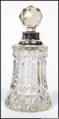 A silver collar hallmarked cut glass perfume bottle bearing marks for London.
