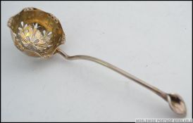 A Victorian silver hallmarked tea strainer spoon by James Dixon & Sons hallmarked for Sheffield