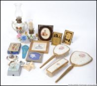 A mixed lot of curios to include miniature oil lamps , miniature pictures , dressing table set ,