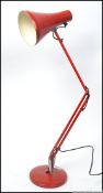 A retro style anglepoise lamp in red in the manner of Herbert Terry with pendant shade