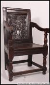 An 18th / 19th century carved oak peg jointed Wainscott chair / armchair.