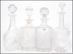 4 glass decanters to include cut glass etc with stoppers though not original