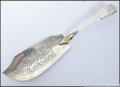 A silver hallmarked George IV fret pierced fish slice bearing London assay mark dated for 1826 by