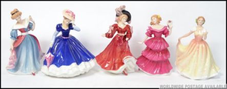 A group of 5 Royal Doulton figures of the year to include 1991 Amy HN3316 , 1992 Mary HN3375 ,