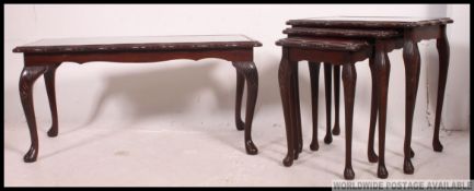 An antique style mahogany and red leather nest of tables together with a matching coffee table.