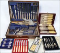 A vintage oak cased canteen of cutlery together with a selection of cased silver plated flat wares.