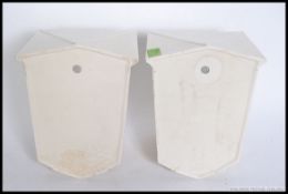 A matching pair of wall pockets / light fixtures, shaped like lanterns stamped to rear SylvaC.