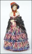 A 1920's Royal Doulton figure ' A Victorian Lady ' HN 728 potted by Doulton and Co, marks to base.
