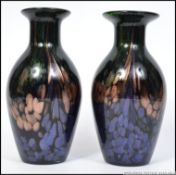 A pair of contemporary studio art glass vases in the manner of loetz having waisted necks and