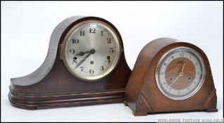 An early 20th century mahogany napoleons hat mantel clock, along with an Art Deco oak mantel clock,