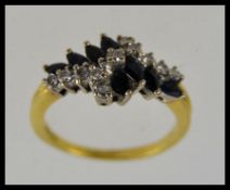 An 18ct gold sapphire and diamond ring.
