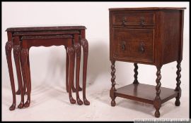 An antique style nest of tables raised on cabriole legs with glass cover tops together with a