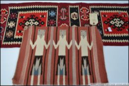 A collection of Navajo rugs having red grounds with geometric patterns ,
