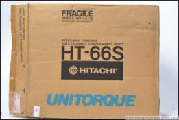 A retro boxed Hitachi Unitorque direct drive record turntable.