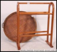 An unusual weave basket of asiatic form together with a contemporary American beech wood quilt rack