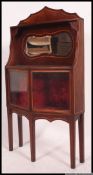 An unusual small Edwardian thin mirror back china display cabinet.