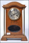A 19th century Arts & Crafts oak mantel clock by Junghans.