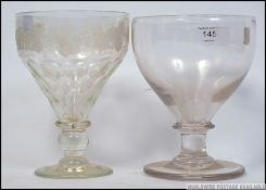 A 19th century large rummer glass with oversized bowl together with an acid etched rummer glass