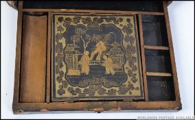 A 19th century Japanese laquered rectangular work box / jewellery box decorated with birds amongst