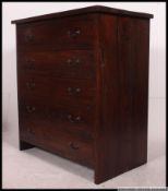 A large contemporary heavy solid wood chest of drawers.
