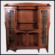 A late 19th century Liberty & Co large solid oak bookcase cabinet.