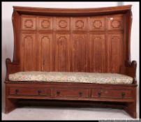A fabulous 19th century large country pine inverse bow fronted pew / monks bench.