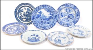 2 19th century Delft plates in blue and white with floral sprays together with a 19th century
