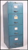 A set of four drawer vintage industrial metal filing cabinet, painted blue with chrome handles,