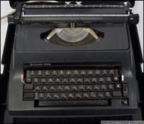 A 1970's Silver Reed electric typewriter, within the original case.