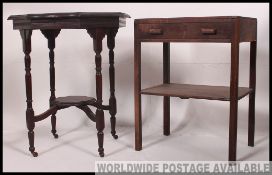 A Victorian mahogany lamp table raised on turned legs with shaped top together with a 1930's oak