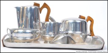 A good retro mid century 5 piece Picquot Ware teaset complete with the tray along with a Calibri