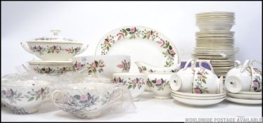 An extensive Wedgwood Hathaway Rose part dinner and tea service to include gravy boat , meat plate ,
