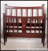 An Edwardian mahogany inlaid double bed.