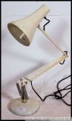 A vintage / retro 1960's / 70's white Herbert Terry Anglepoise desk lamp having a circular base