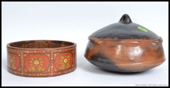 A large African clay cooking pot with lid together with another ( see illustrations )