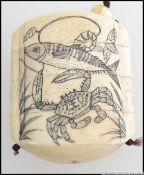 A four section carved bone inro, decorated with birds to both sides. Four opening strung sections.