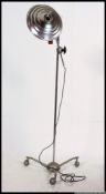 A vintage mid century floor standing adjustable heat lamp by Hanovia,