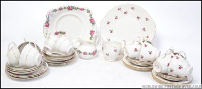 A Colclough chintz pattern part tea service together with a similar Tuscan china part service.
