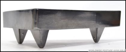 A good 20th century contemporary design triangular Beswick Dish model no 1985 being raised on