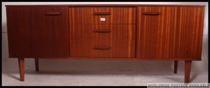 A good quality Danish style sideboard in teak wood having 3 central drawers flanked by cupboards