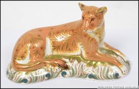 A Royal Crown Derby paperweight Lioness limited to 950 pieces with gold stopper.