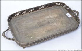 A good quality silver plate salver tray with twin handles, pierced gallery and ball and claw feet.