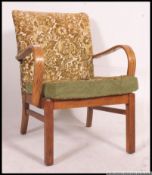 A retro mid century bentwood oak fireside armchair.