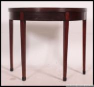 A Georgian 19th century demi lune mahogany card table.