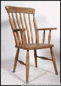 A Victorian beech and elm wood Windsor chair / armchair.